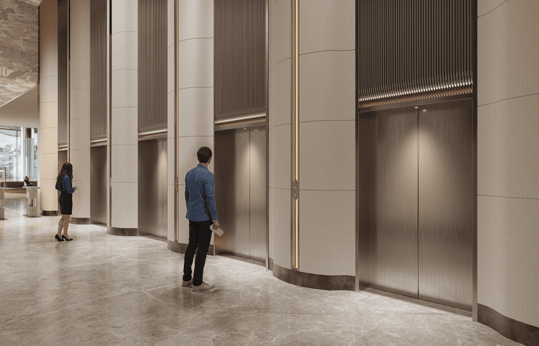 Elevator lobby with stone walls and bronze detailing