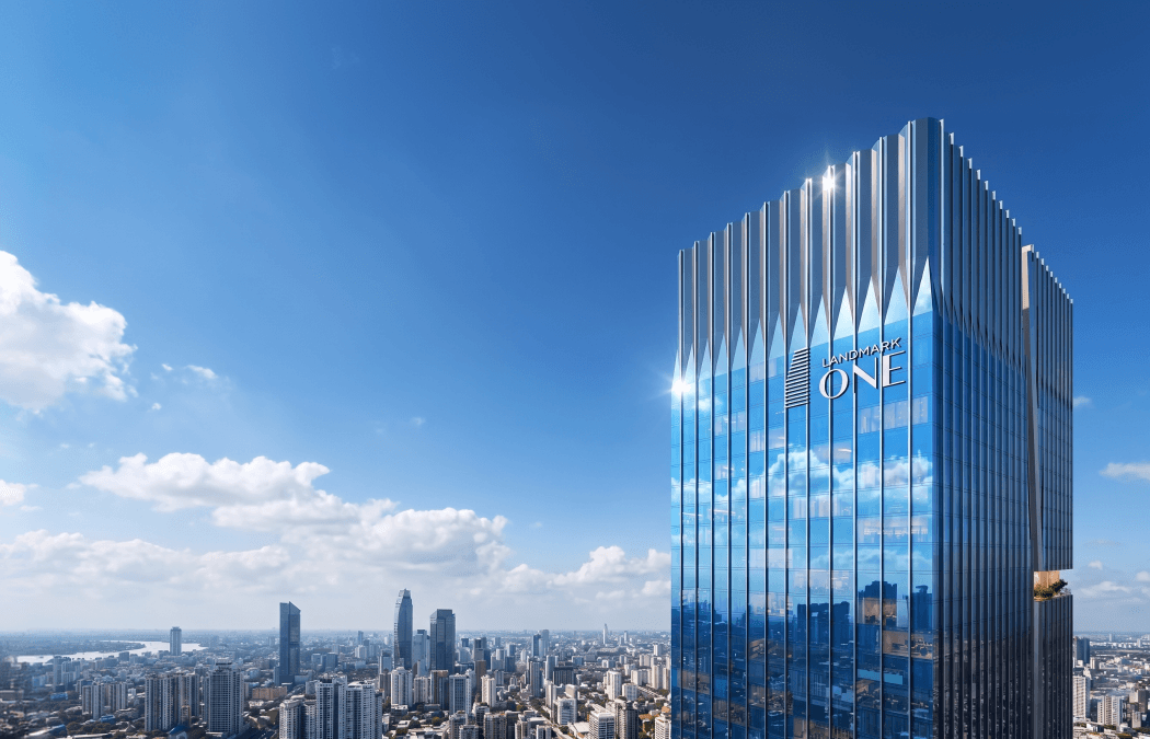 The glazed crown of Landmark One above the city